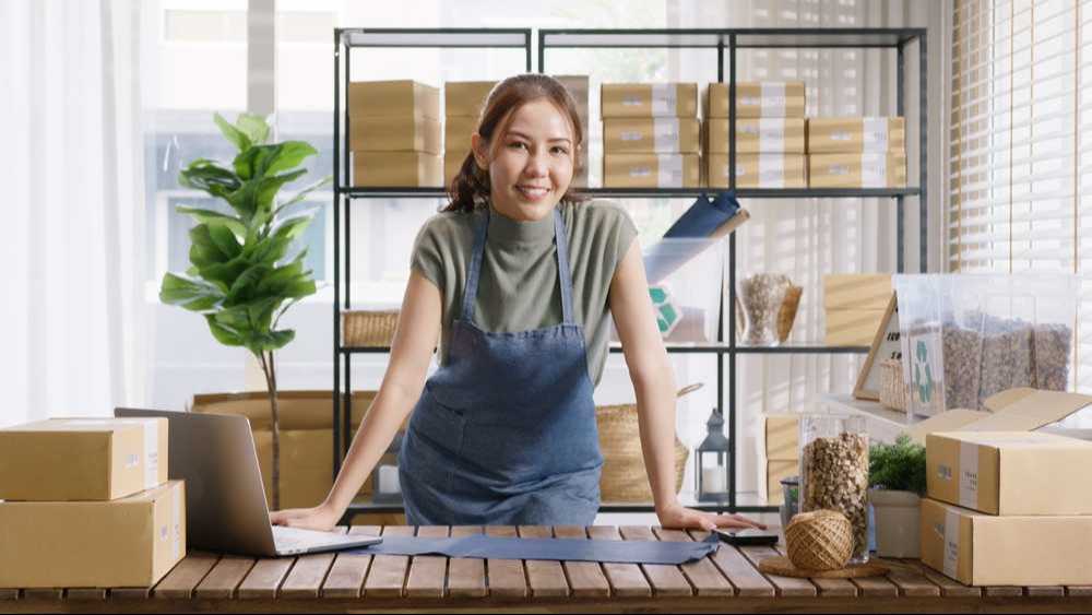 Go green vendor use eco packaging parcel carton box in net zero waste store asian seller retail home office shop